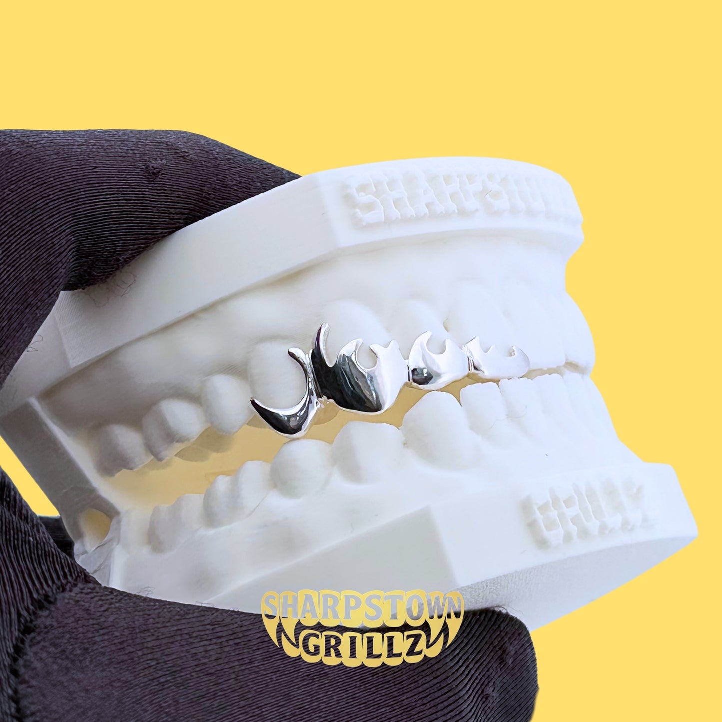 Custom-made flame drip teeth grillz available in premium Silver 925 and 10K Gold options.