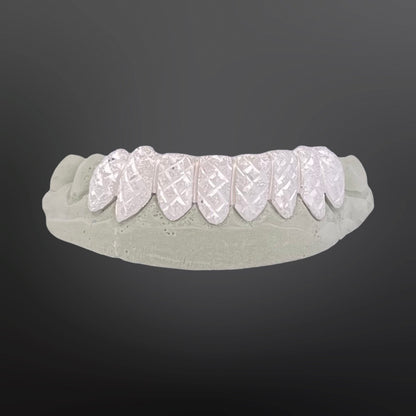 Dental model with white dental implants on a dark gray background