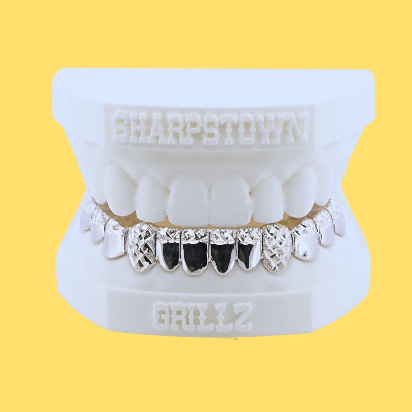 Custom 925 silver bottom teeth caps with black enamel inlay and diamond dust cut outer teeth.