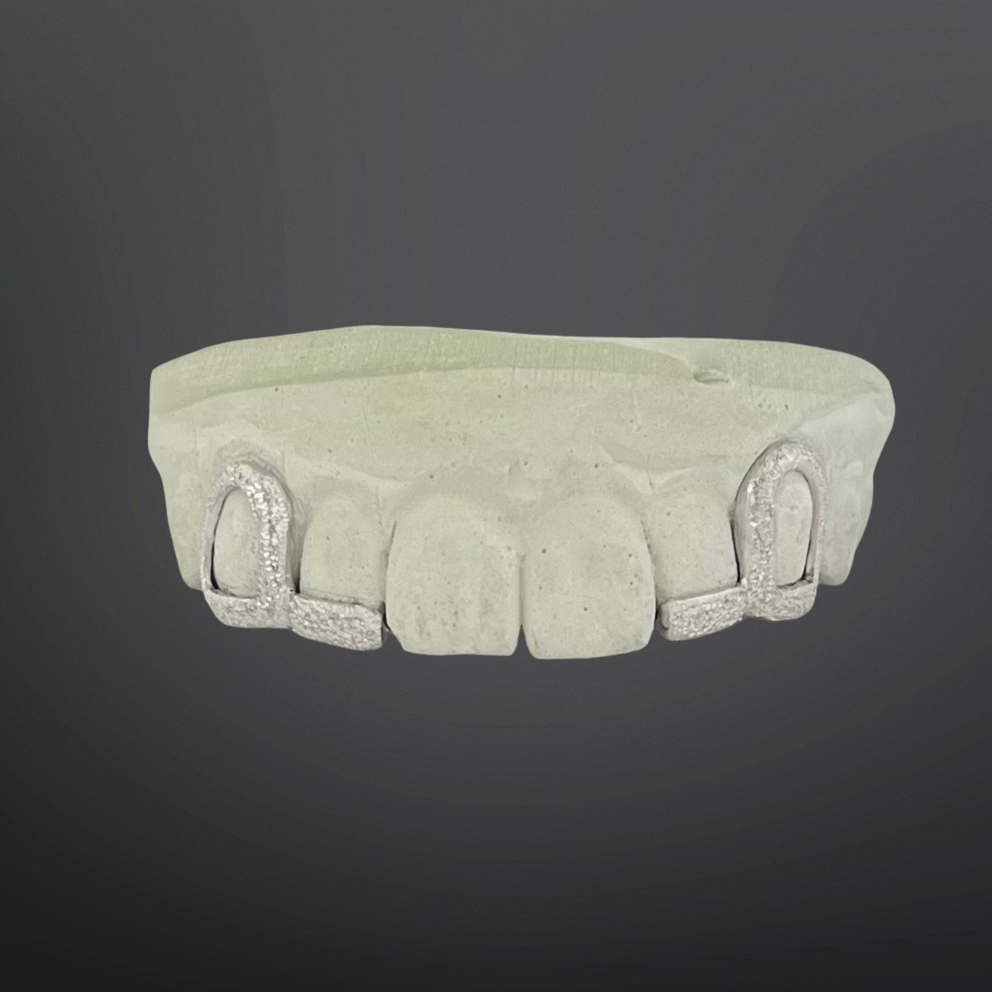 Decorative stone cornice on a dark background