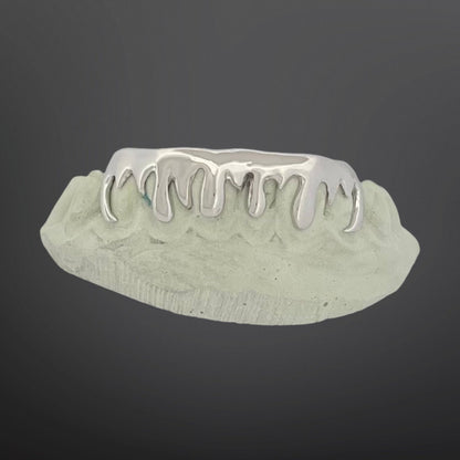 Silver grill on a gray background