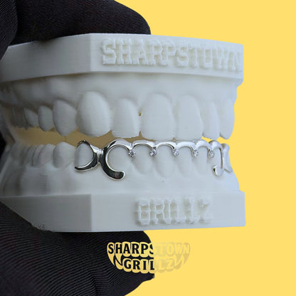 Custom-made upper diamond cut diamond dust teeth grillz available in Silver 925 and 10K Gold.