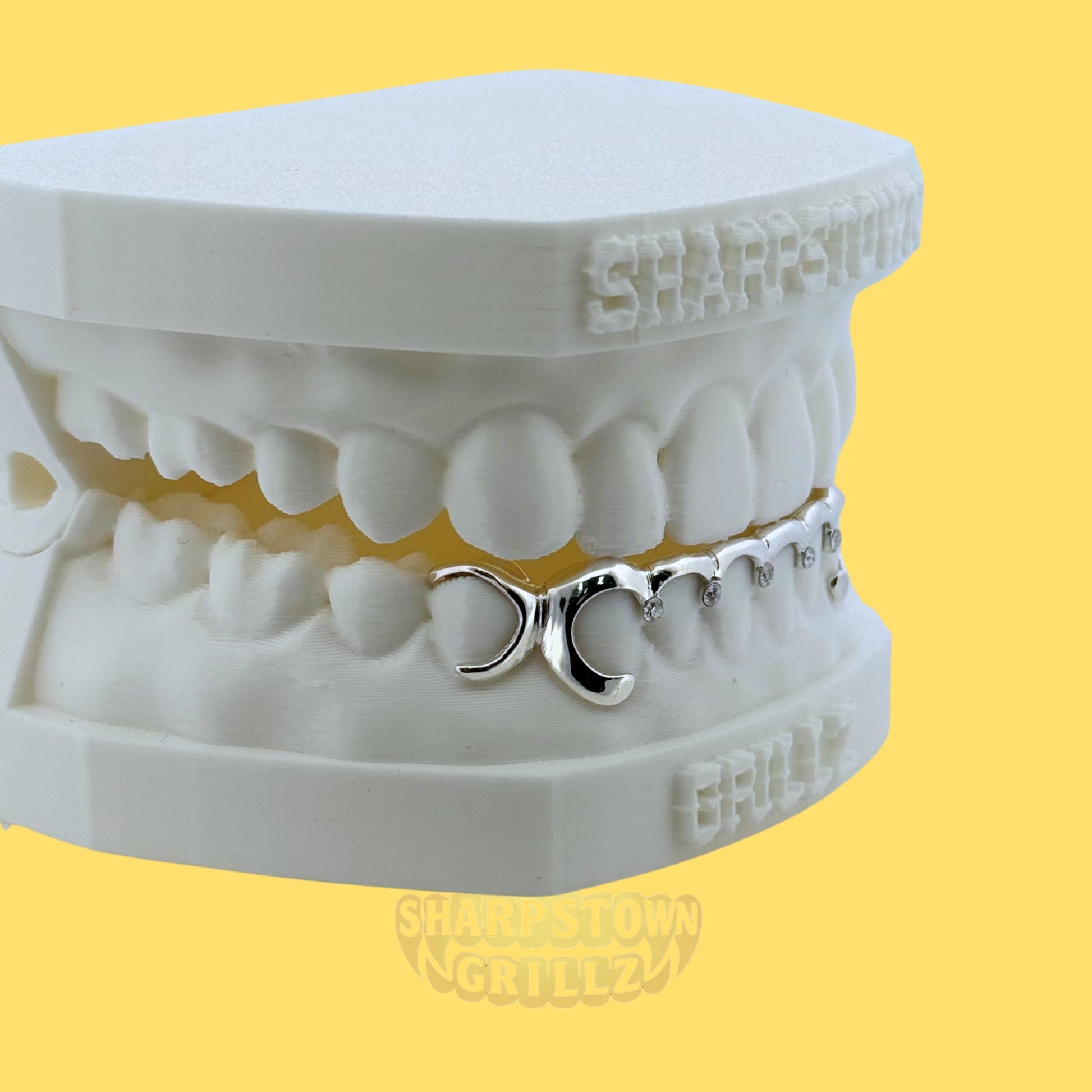 Custom 10K Gold diamond cut top teeth caps with diamond dust textured faces.