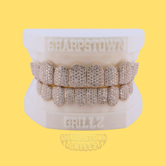 Silver 925 iced-out full set teeth caps with brilliant round micro pave stones.