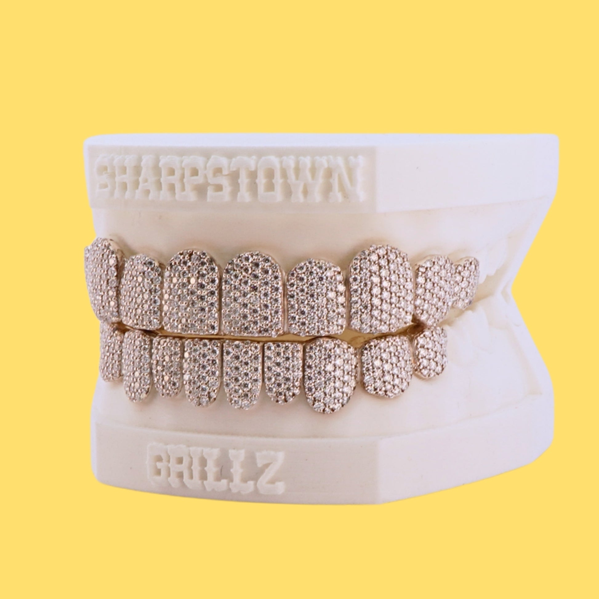Full mouth iced-out custom teeth caps in Silver 925 with micro pave setting.