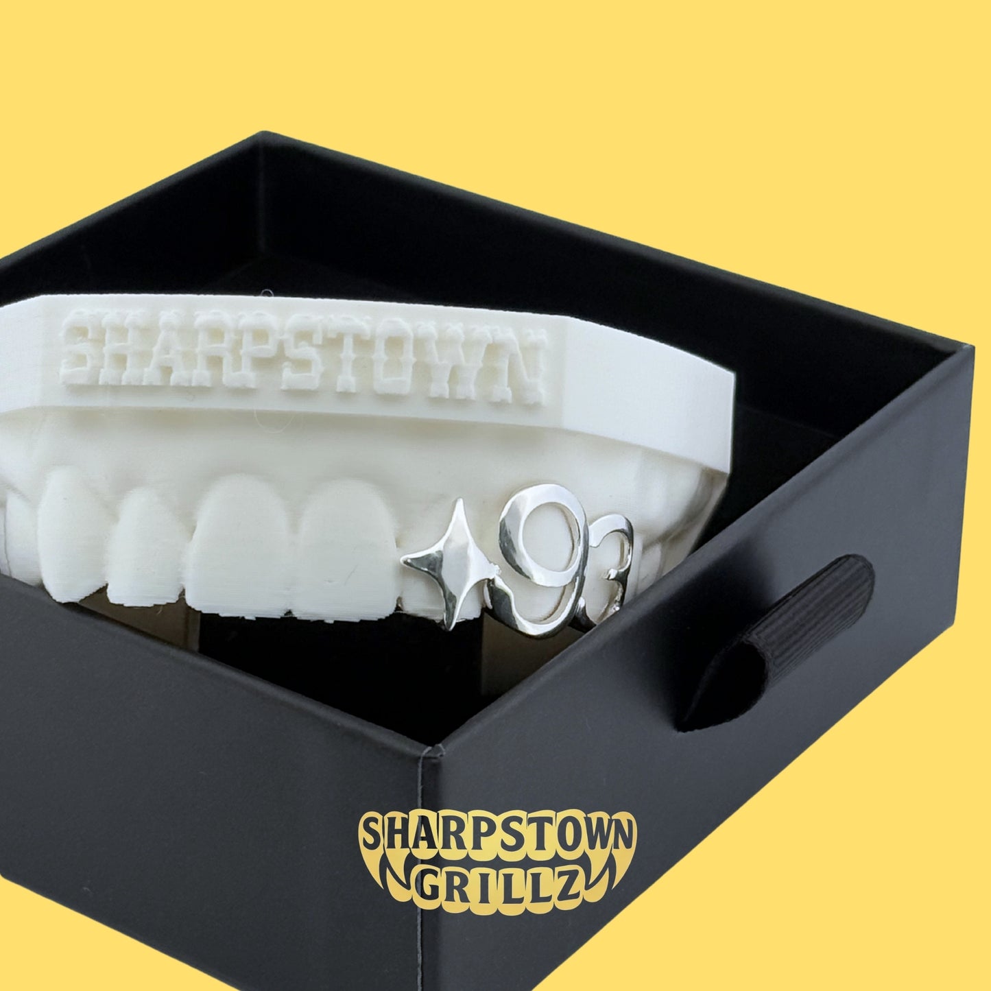 Personalized custom number and initial open frame grillz set fitted on upper and lower teeth mold