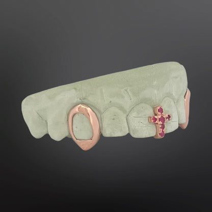 Decorative lip ring with gemstone accents on a dark background