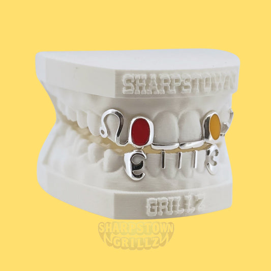 Custom 10K Gold or Silver 925 open window year grillz with vibrant red and yellow enamel fills.