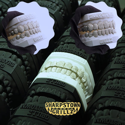 Custom Silver 925 full set diamond dust textured grillz on a white dental cast model.