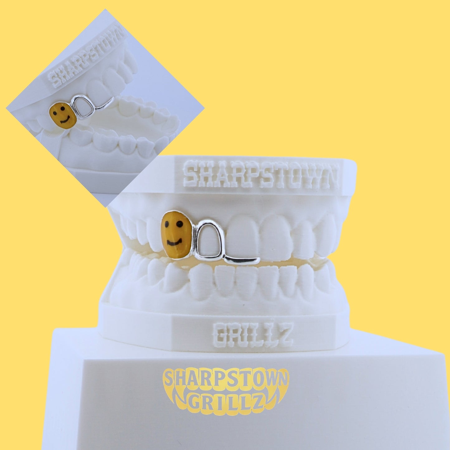 Yellow enamel smiley face tooth cap paired with open face wireframe grill on a 3D dental cast.