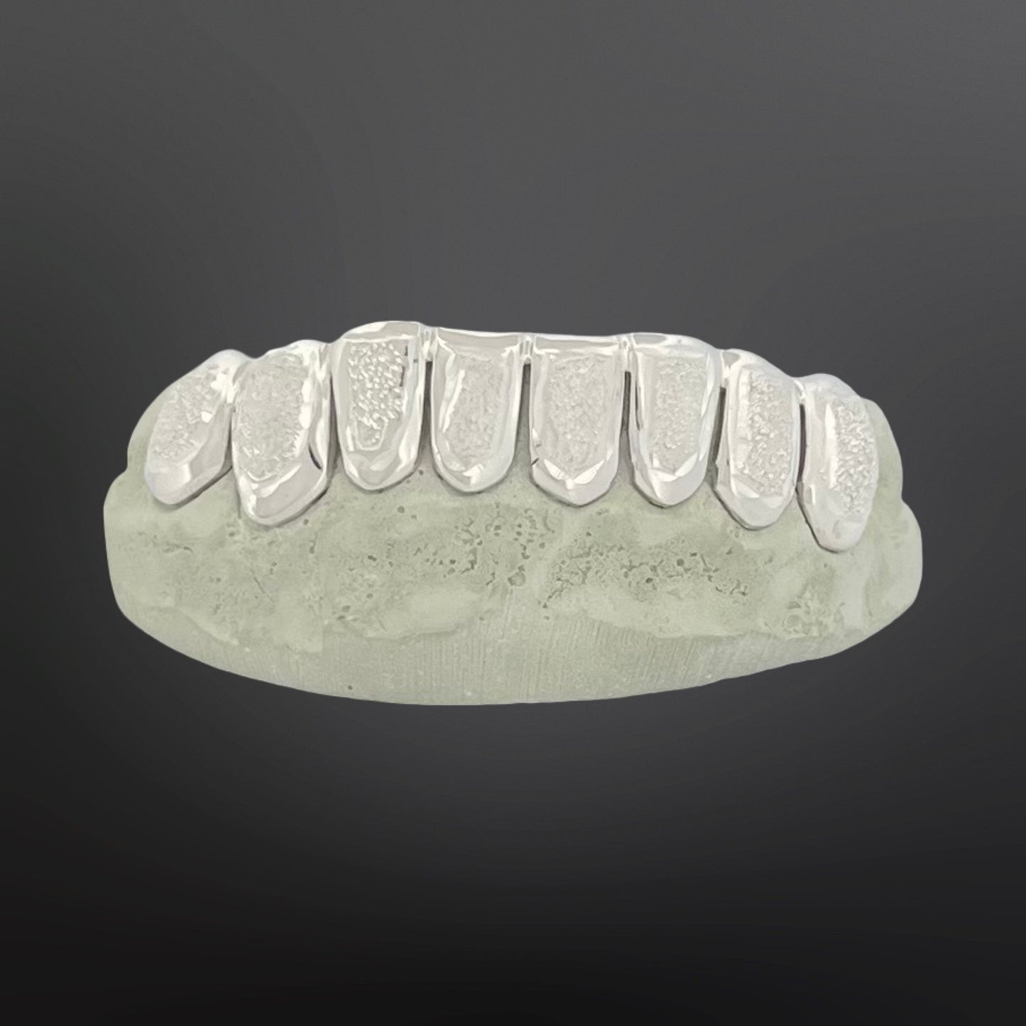 Dental model with clear aligners on a dark gray background