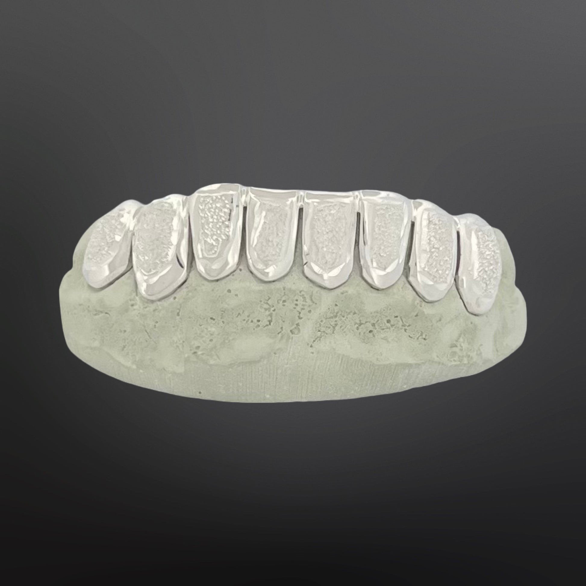 Dental model with clear aligners on a dark gray background