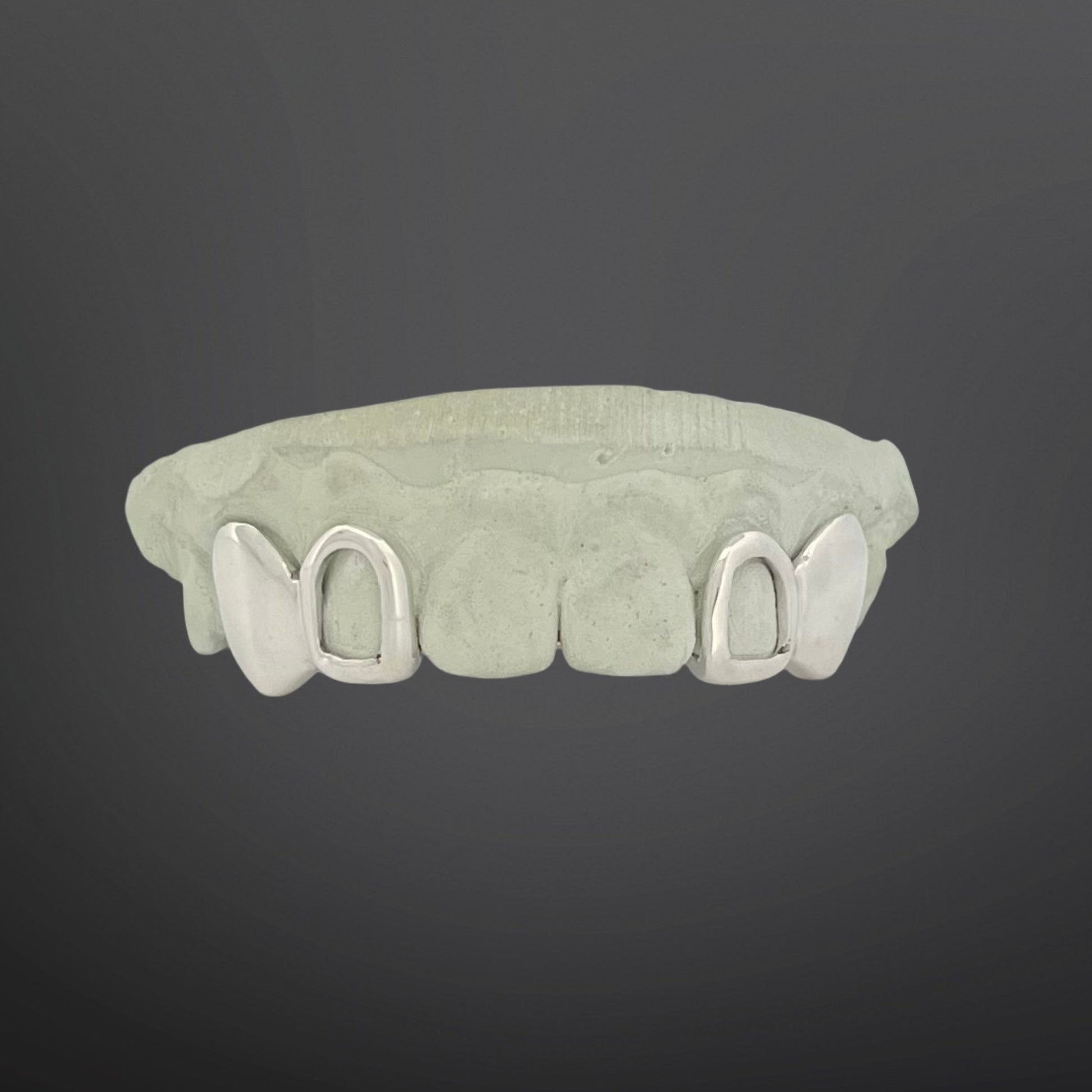 Set of dental aligners on a dark gray background