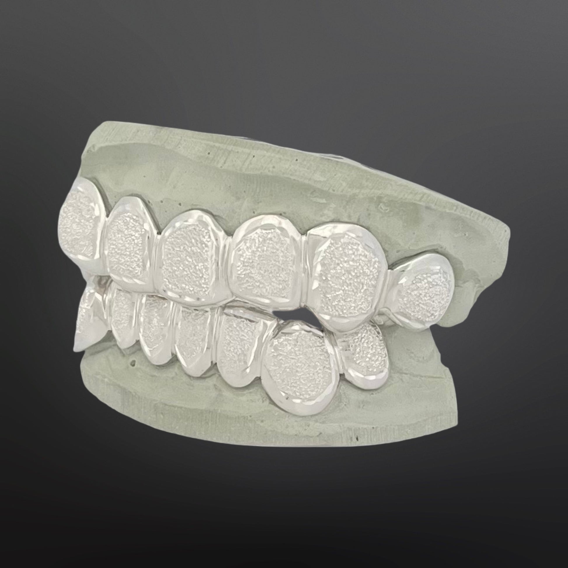 Dental model of teeth on a dark background