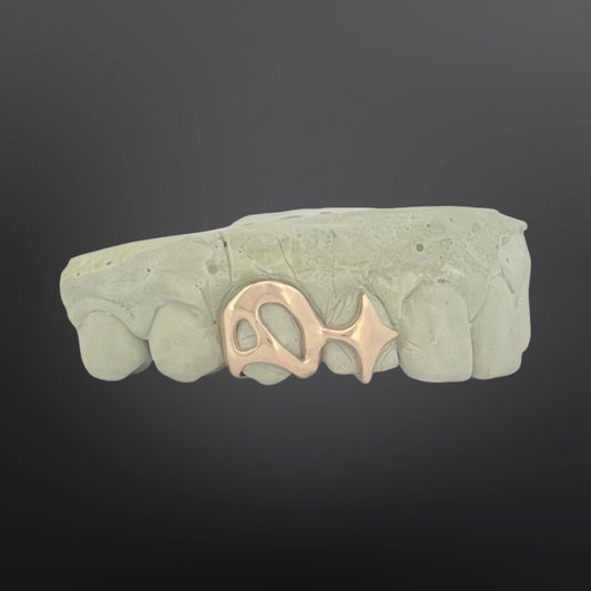 Abstract Open Face and Four-Pointed Star Two Teeth Natural Gold
